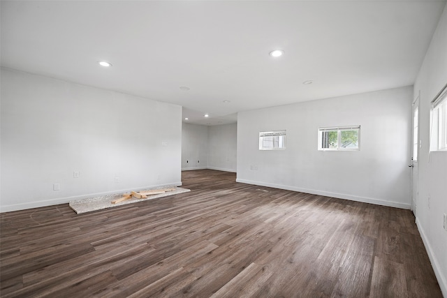 spare room featuring dark hardwood / wood-style flooring