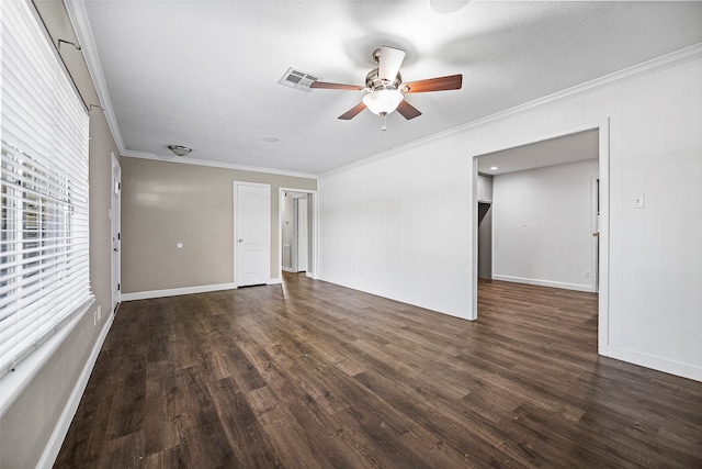 empty room featuring ornamental molding, a textured ceiling, ceiling fan, and dark hardwood / wood-style floors