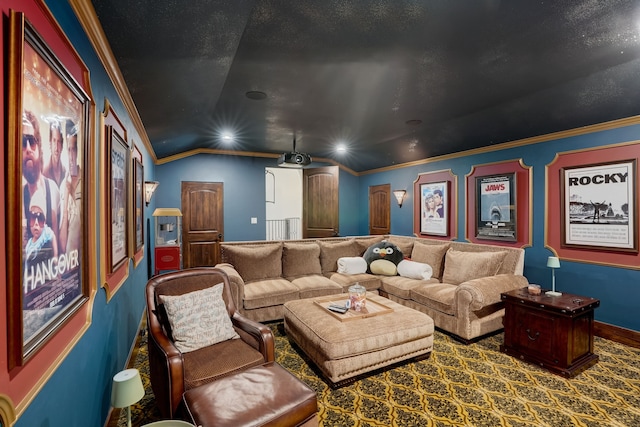 cinema with carpet, ornamental molding, and lofted ceiling