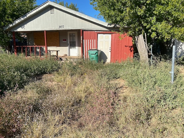 view of outdoor structure featuring a porch