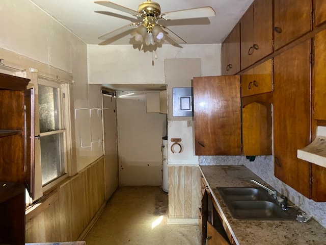 kitchen with backsplash, ceiling fan, ventilation hood, and sink