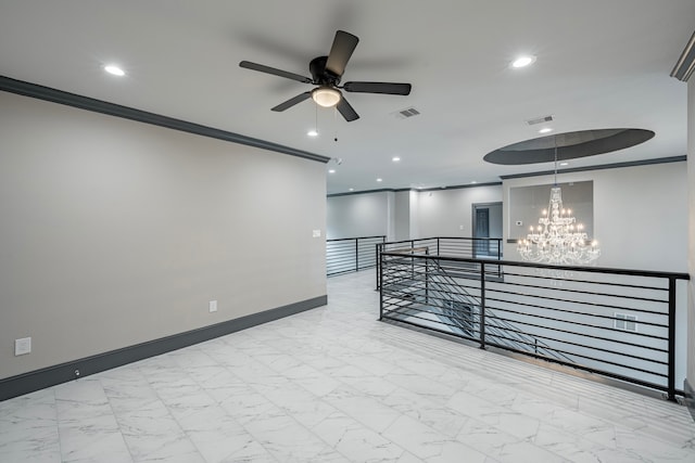 empty room featuring ceiling fan with notable chandelier and crown molding