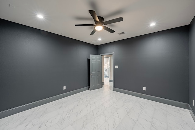 unfurnished room with ceiling fan