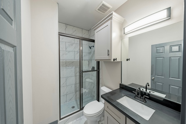 bathroom with vanity, toilet, and an enclosed shower