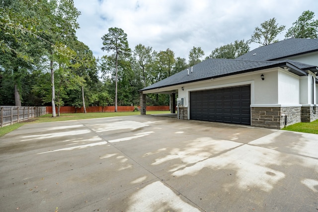 view of side of home featuring a garage