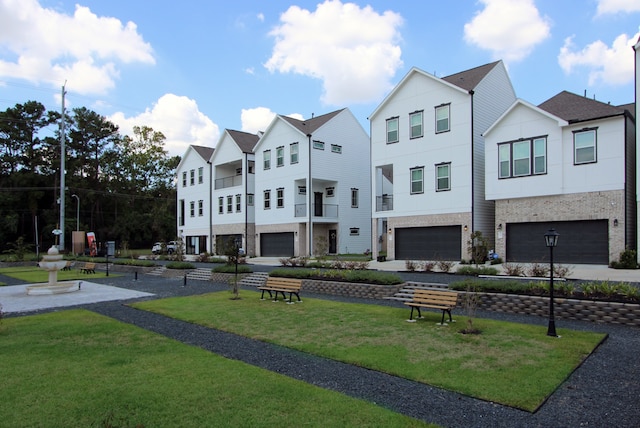 exterior space featuring a front yard and a garage