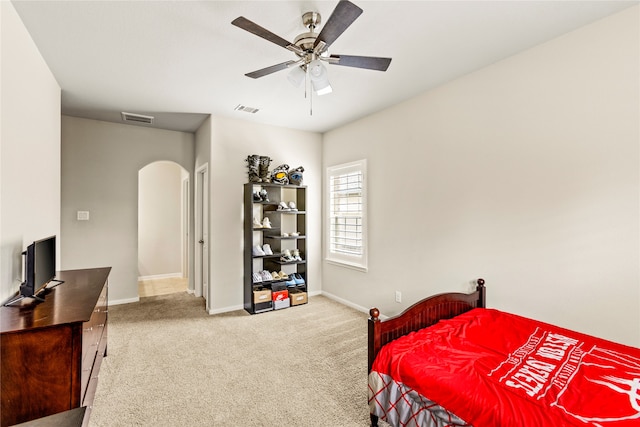 bedroom with ceiling fan and carpet floors