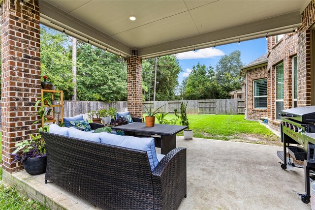 view of patio / terrace featuring an outdoor living space and grilling area