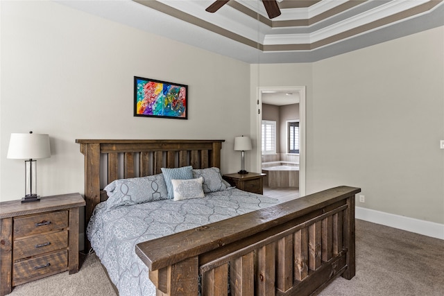 carpeted bedroom with ceiling fan, ensuite bath, and ornamental molding