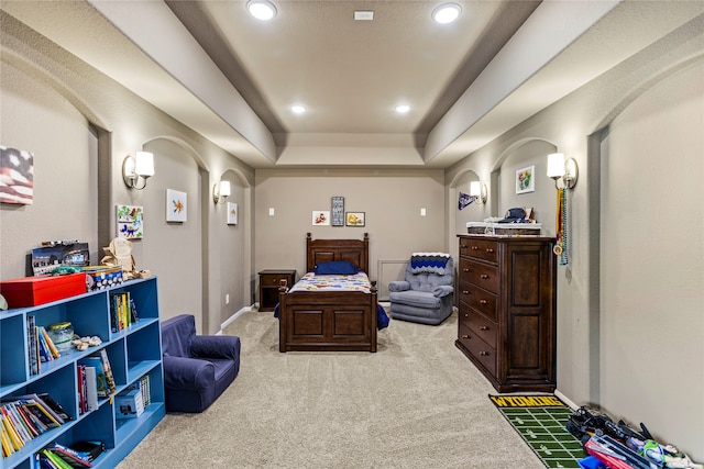 bedroom featuring light carpet