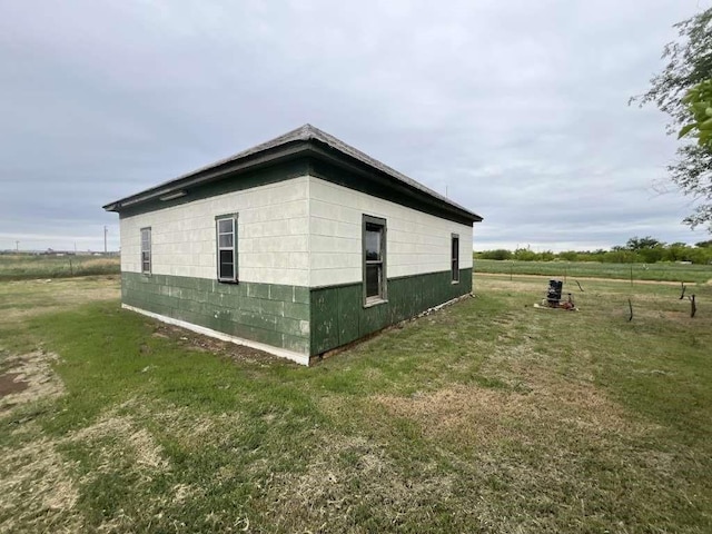 300 E Curtis St, Quanah, TX 79252 - view of home's exterior featuring a yard