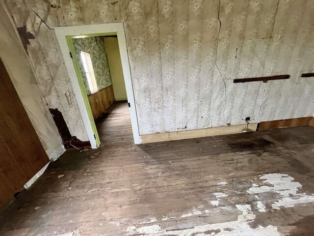 300 E Curtis St, Quanah, TX 79252 - unfurnished room with wood-type flooring and baseboards