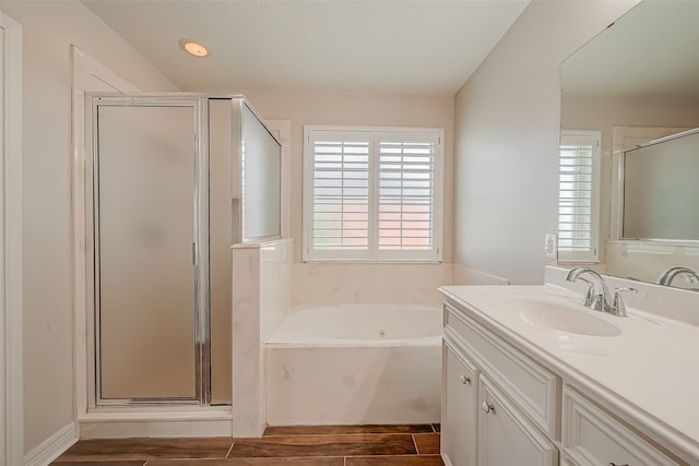 bathroom featuring separate shower and tub, wood-type flooring, and vanity