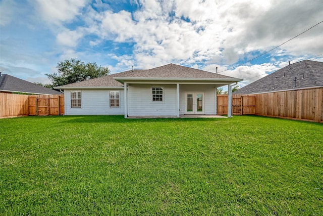 8705 Rowen Ct, Needville, TX 77461 - rear view of property with french doors, a fenced backyard, a yard, and roof with shingles