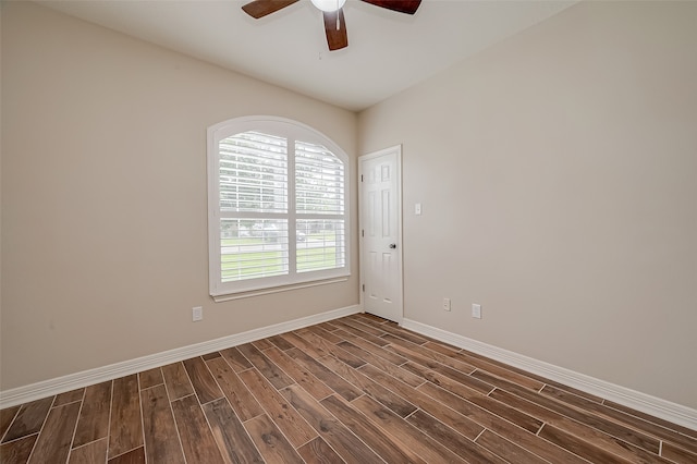 unfurnished room featuring dark wood-type flooring and ceiling fan