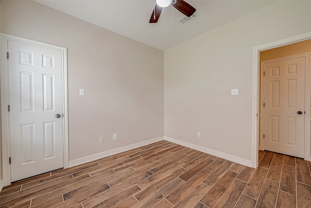 unfurnished room with hardwood / wood-style flooring and ceiling fan