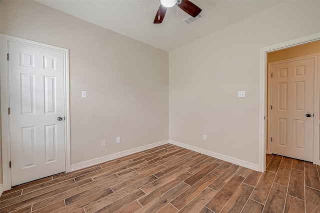 8705 Rowen Ct, Needville, TX 77461 - empty room featuring ceiling fan, baseboards, wood finished floors, and visible vents