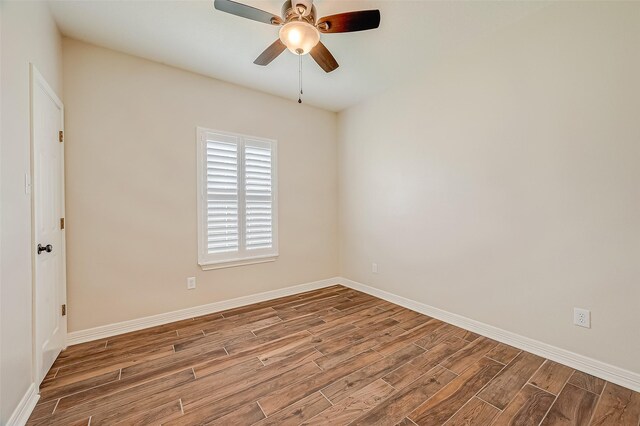 8705 Rowen Ct, Needville, TX 77461 - unfurnished room featuring a ceiling fan, wood finished floors, and baseboards