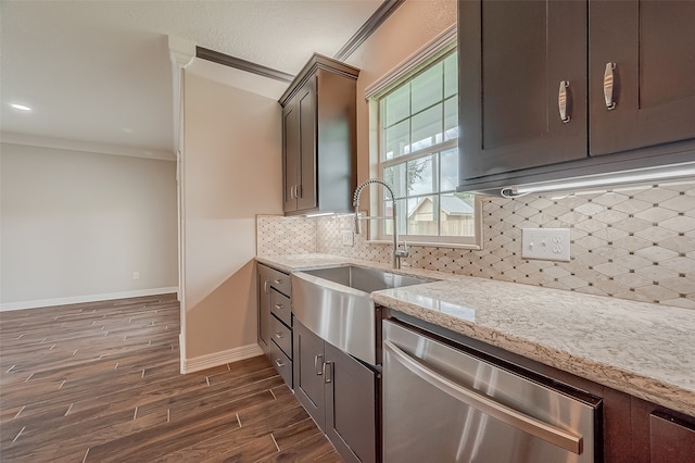 kitchen featuring dark brown cabinets, dishwasher, light stone counters, decorative backsplash, and dark wood-type flooring