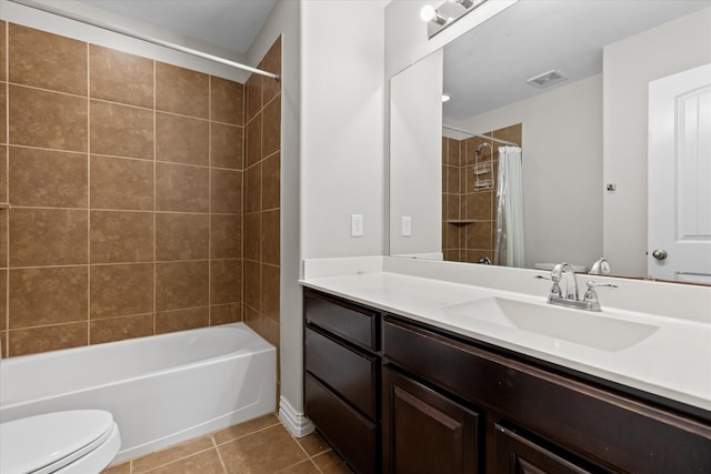 full bathroom featuring shower / tub combo with curtain, tile patterned floors, vanity, and toilet