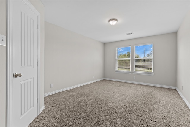 unfurnished room featuring carpet flooring