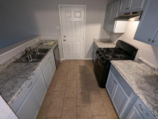 kitchen featuring sink, light tile patterned flooring, stainless steel dishwasher, and black gas range oven