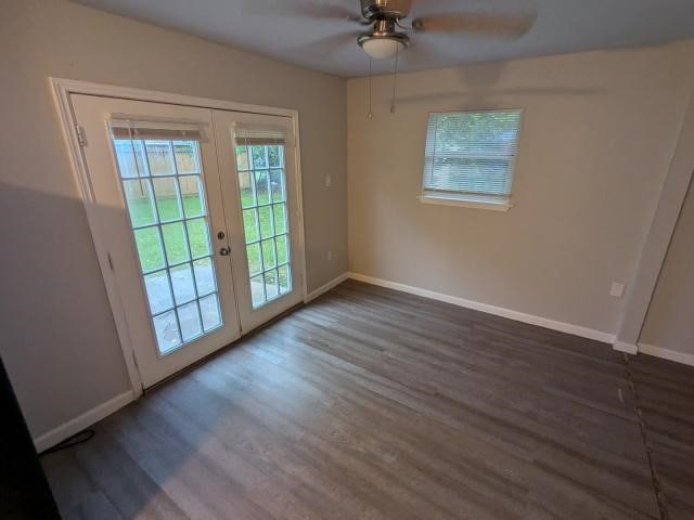 doorway with french doors, dark hardwood / wood-style flooring, and ceiling fan