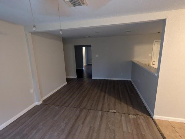 spare room with hardwood / wood-style floors