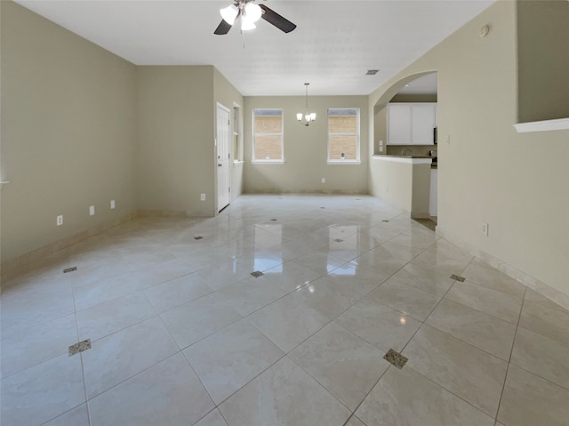 unfurnished living room with ceiling fan and light tile patterned floors