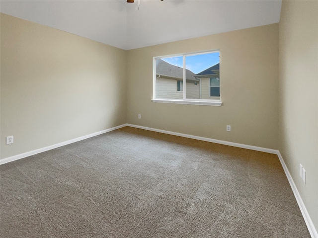 carpeted empty room with ceiling fan