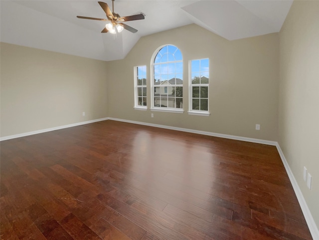 unfurnished room with lofted ceiling, ceiling fan, and dark hardwood / wood-style floors