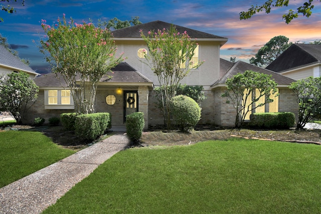 view of front of home with a yard