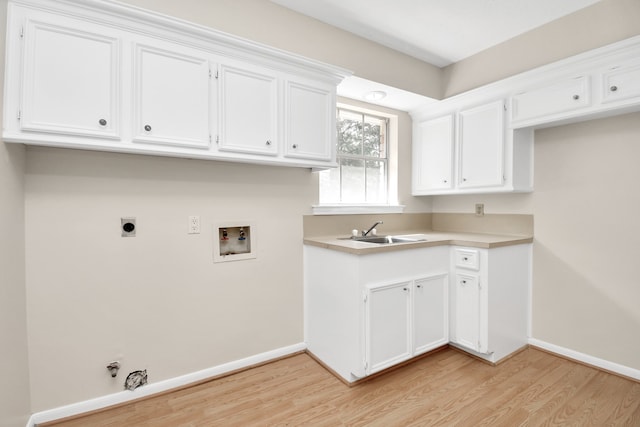 laundry room featuring light hardwood / wood-style flooring, gas dryer hookup, hookup for a washing machine, and sink