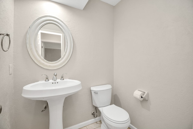 bathroom featuring tile patterned floors, sink, and toilet