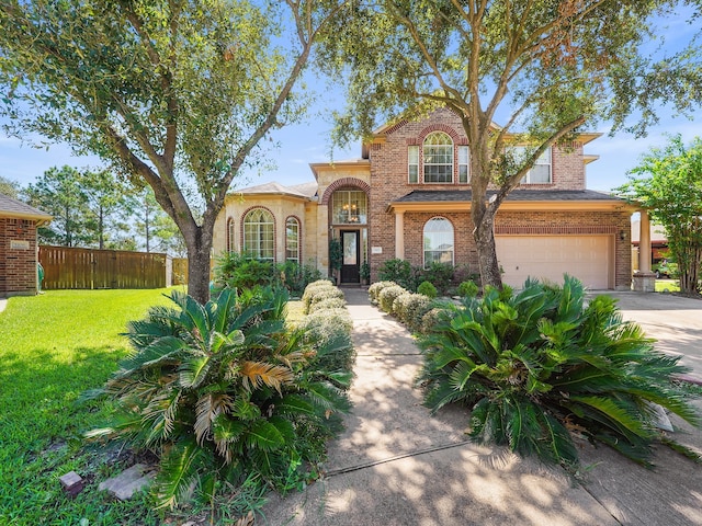 view of front of home featuring a garage and a front yard