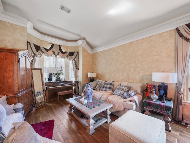 living room featuring crown molding and hardwood / wood-style flooring