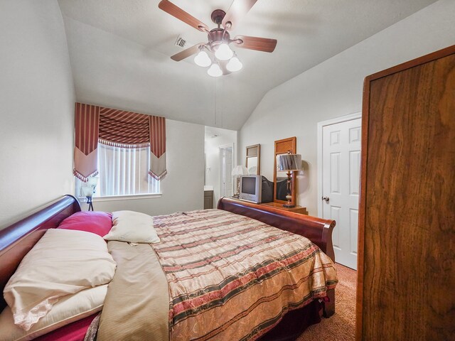 bedroom with vaulted ceiling, ceiling fan, and carpet