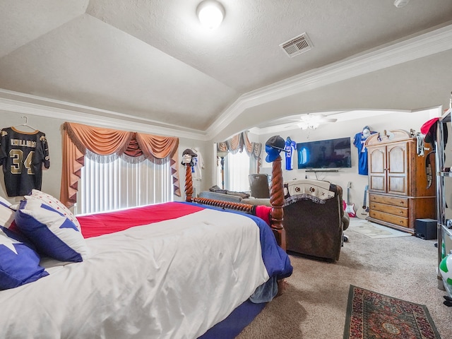 carpeted bedroom featuring a textured ceiling, vaulted ceiling, and ornamental molding