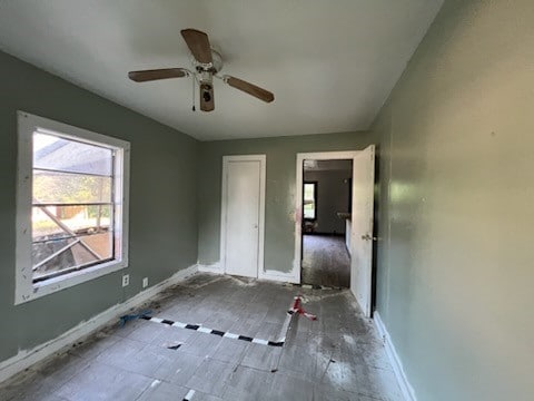 unfurnished bedroom with ceiling fan