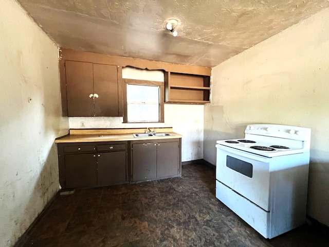 kitchen with white range with electric stovetop, dark brown cabinets, and sink