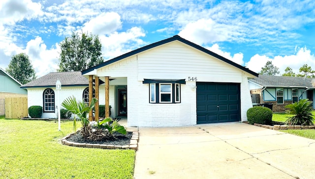 view of front facade featuring a garage and a front lawn