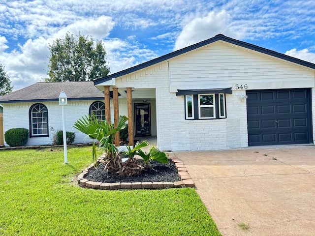 single story home with a garage and a front yard