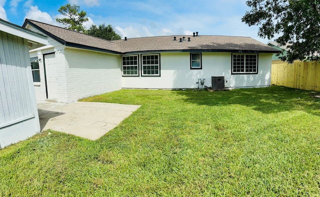 back of house with a patio area, a yard, and cooling unit