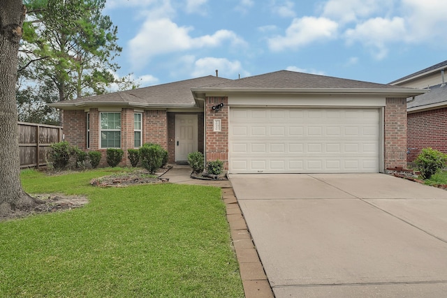 ranch-style home with a front yard and a garage