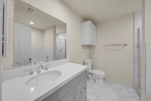 bathroom featuring vanity, toilet, and an enclosed shower