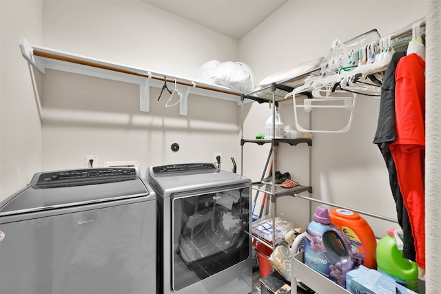 clothes washing area with washing machine and clothes dryer