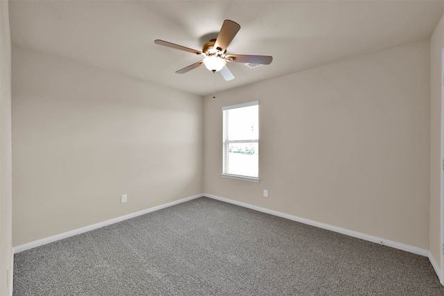 unfurnished room featuring ceiling fan and carpet