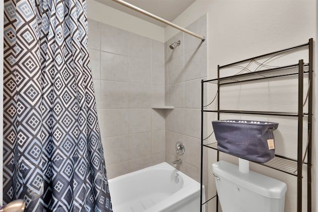 bathroom with shower / tub combo and toilet