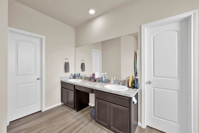 bathroom featuring vanity and hardwood / wood-style flooring