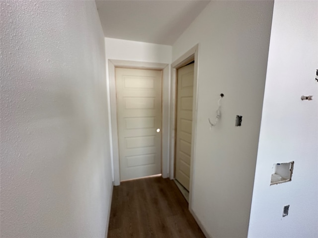 hall with dark hardwood / wood-style floors